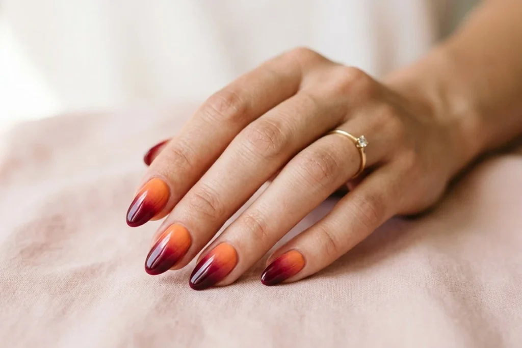 Gradient Orange to Burgundy Nails